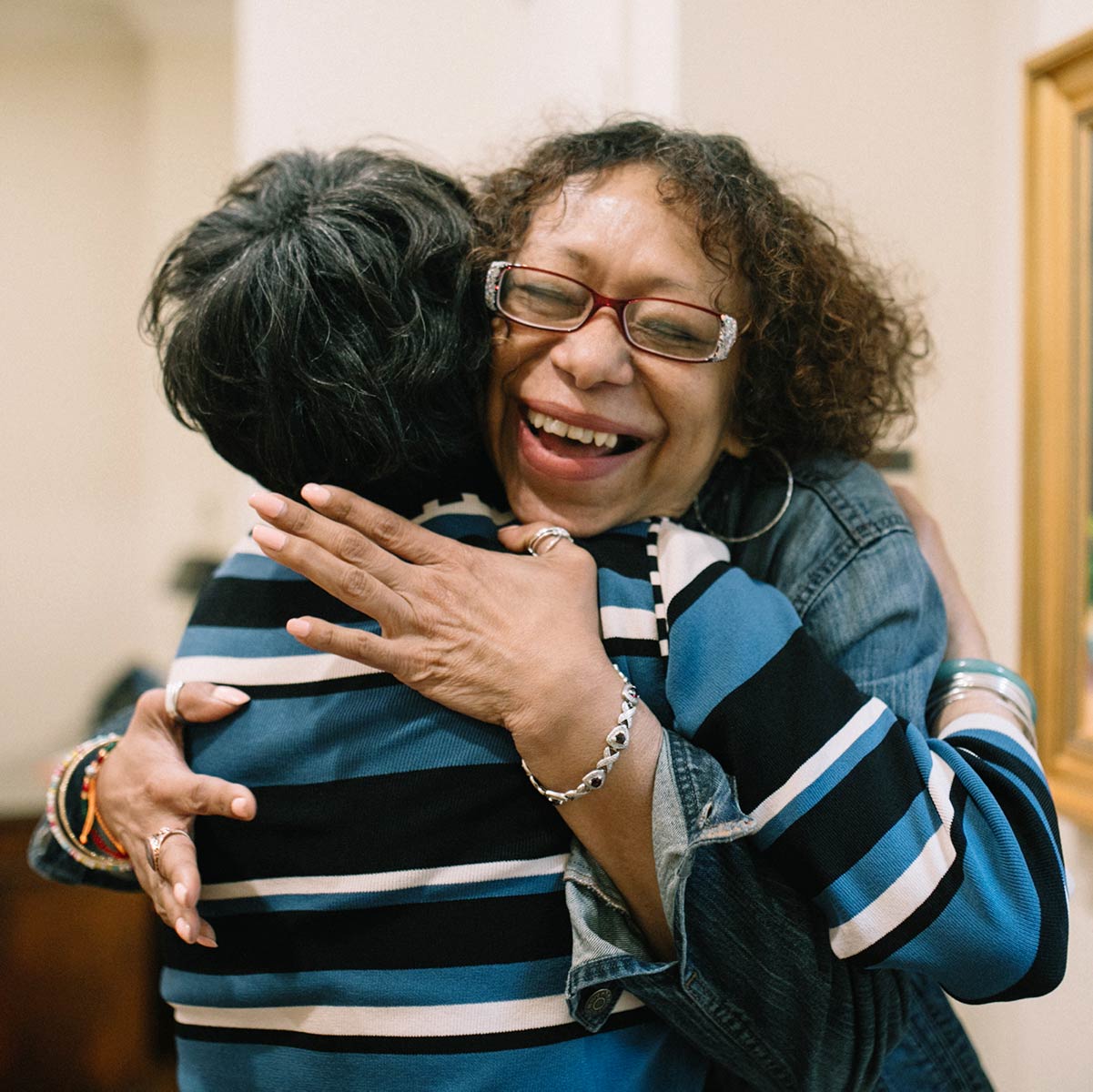 Staff and client hugging