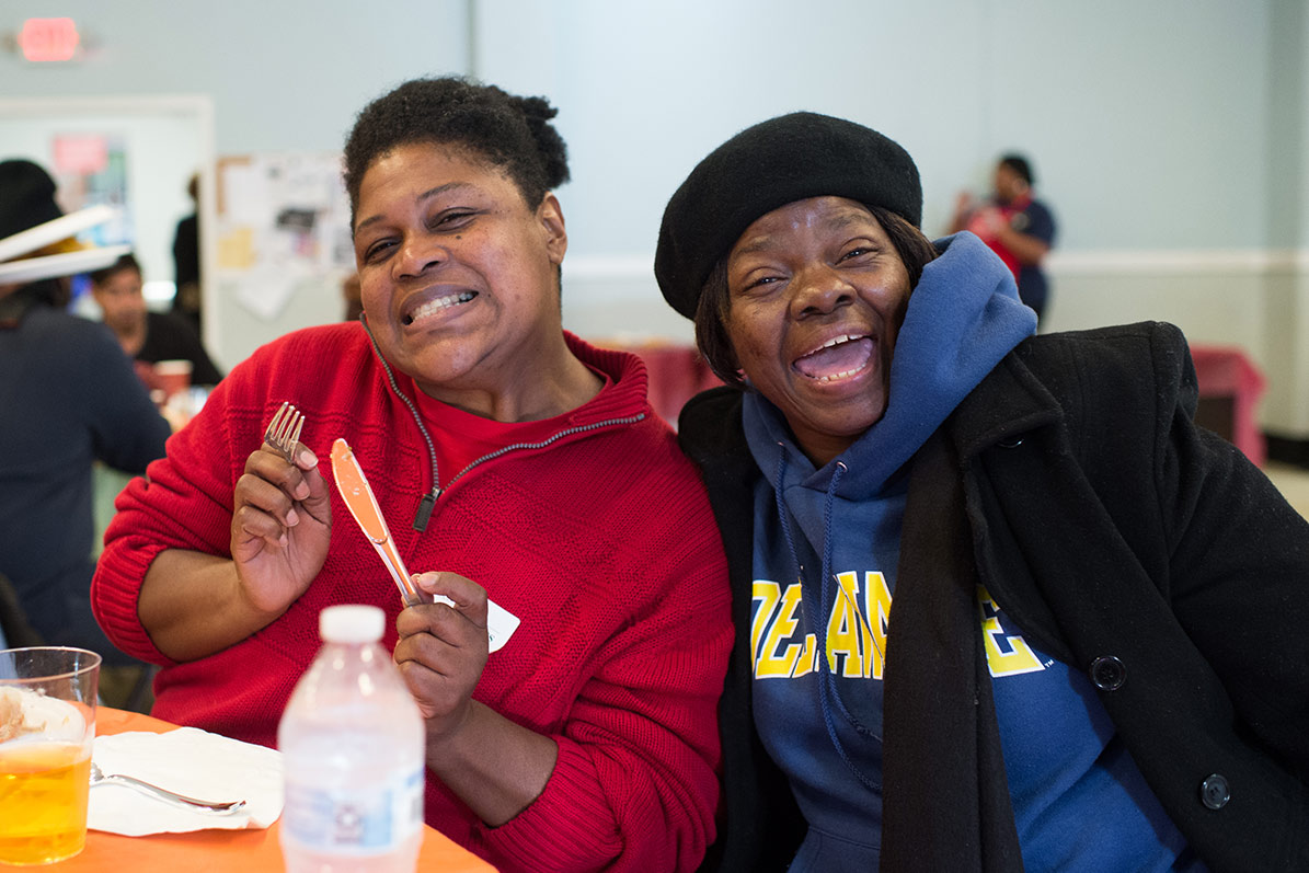 Women enjoying Thanksgiving meal at Goodwill Rescue Mission